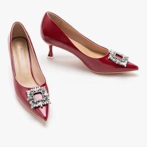 C. Paravano Red Pumps with Silver Buckle